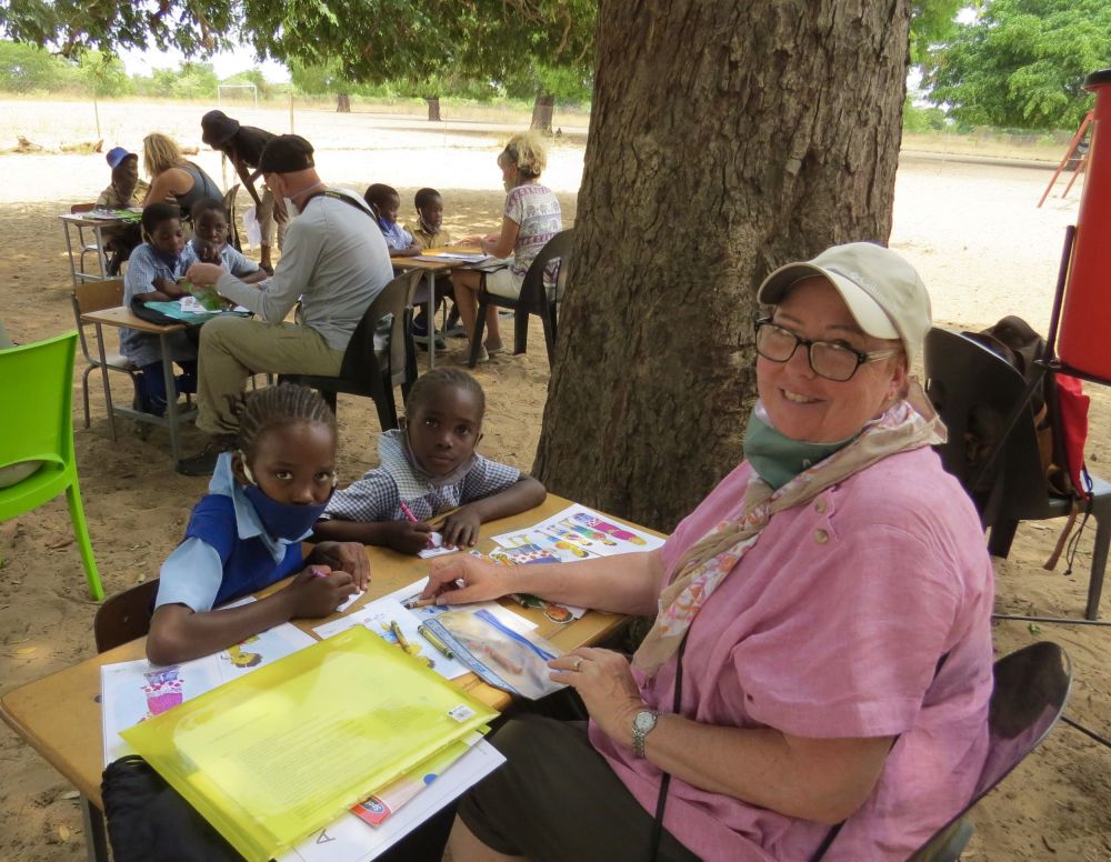 We also arrange a little time for our friends to sit down and teach a couple of young students to read and draw