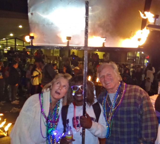 Jim and I wondering how this Flambeau carrier carried it for the 5 mile parade route.