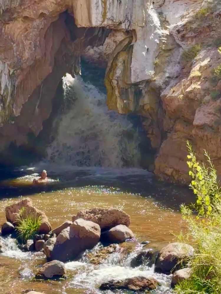 Wild spa and waterfall just on the side of the road.