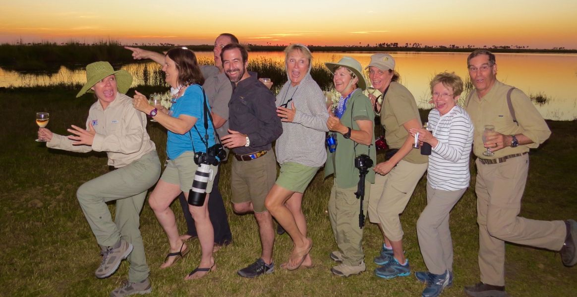 No we are not running from a man eating lion- just having fun with our friends as the orange sun set  over the Chobe River